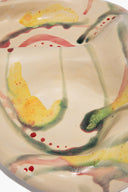 Ceramic catch-all dish, cream with red, yellow, and green abstract glaze splashes