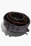 Large Henry bowl side view in dark glaze with sculpted lugs; inner layered glaze shows.