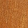 Close-up of warm wood grain on vintage trinket box lid surface.