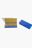 Henry Blue rolling papers, open blue box with yellow-striped inner papers