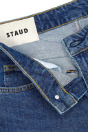 Stone blue stretch flare jeans waistband and front pocket with button fly