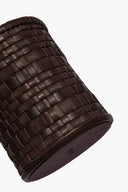 Woven leather candle sleeve in espresso, textured grid pattern and stitched edge