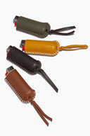 Olive green leather lighter cover with stitched edge, metal snap, and wrist strap.