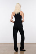 Black high-rise jeans back view with belt loops and center seam