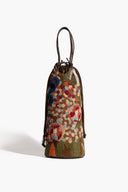 Multicolor beaded wine bottle bag with drawstring top and braided dark handles