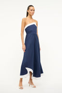 Navy strapless midi dress with white trim and asymmetrical hem opening