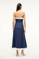 Navy strapless midi dress from back with white hem panel