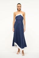 Navy strapless midi dress with white diagonal overlay and curved asymmetrical hem