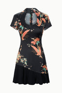 Black silk dress with short sleeves, colorful floral bird print, angled panel hem