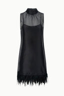 Black sleeveless mini dress with high neckline and feathered hem