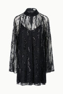 Black mini dress with high neck and sheer sequined long sleeves