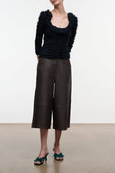 Dark brown leather culotte with wide leg, mid-calf length and front pockets