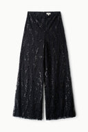 Black sequin wide-leg pants with allover dot pattern