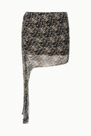 SEPHIE skirt with speckled black-and-cream print, angled high-low hem and drape