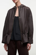 Hooded leather jacket in dark brown, front zip, adjustable drawstring hood, pockets.