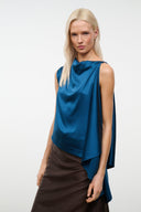 Blue draped silk top with cowl neck, sleeveless design and asymmetric hem