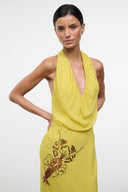 Citron yellow halter dress with embroidered insect graphic at bodice