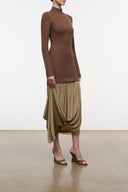 Women's long-sleeve fitted dress with draped olive skirt and asym hem, brown top.