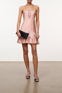 Quartz pink silk slip dress with lace trim, spaghetti straps, and flared ruffle hem