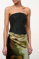 Strapless silk bodice in black with draped waist and green-gold tropical print