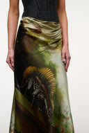 Strapless silk dress with black top and side drape, olive green palm print