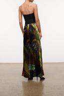Strapless silk dress back view with black bodice and green tropical maxi skirt