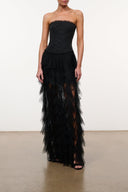 Black strapless corset dress with layered tulle ruffles and long tiered skirt