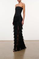 Black strapless gown with tiered tulle ruffle skirt and layered ruffle tiers