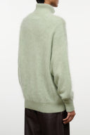 Spearmint cashmere sweater back view with stand collar and ribbed knit cuffs