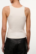 Ivory sleeveless ribbed tank top with small chest dino graphic and crew neckline.