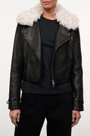Black leather biker jacket with shearling collar, asymmetrical zipper, and chest zips