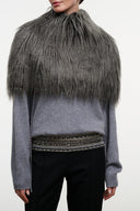 Graphite faux-fur shrug with front drape over gray sweater and beaded belt detail