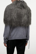 Graphite faux-fur shrug with draped shoulders over gray knit top