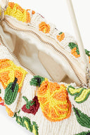 Interior of beaded fruit bean bag purse with zipper and multicolor bead trim