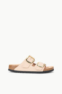 Beige slide sandal with two straps and oversized gold-tone buckle detail, open toe