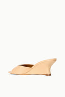 Tan wedge mules with open toe and curved wedge heel