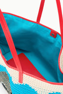 Interior view of blue-and-cream tote bag with red trim and red handle seams
