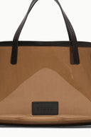 Mini tote bag interior close-up with 'STAUd' patch and black handles