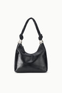 Black slouchy cuff shoulder bag with braided knotted handles and shiny finish