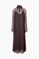 Dark brown sheer long-sleeve maxi dress with high neckline and layered underlayer