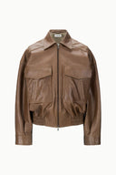 Brown leather cropped bomber jacket with zip front and double flap pockets