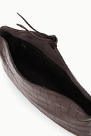Croc-embossed clutch bag interior with black lining and zip closure