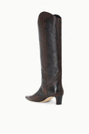 Dark brown western boot with slim heel and pointed toe; visible shaft seam