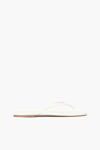 White thong sandal with thin toe strap and flat sole
