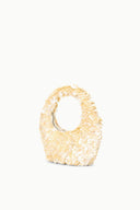 Cream sequined mini tote with loop handle, scallop embellishment texture.