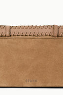 Tan suede shoulder bag front panel with stitched detail and “STAUD” logo