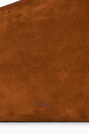 Tabac suede shoulder bag close-up with STAUD logo embossed near the bottom