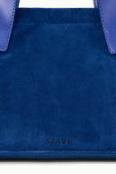 Cobalt blue port tote front with stitched seams and small STAUD logo patch