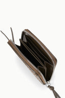 Hand-woven zip wallet open, showing card slots and interior pocket in dark brown