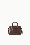 Mini carryall handbag, croc-embossed espresso brown with top handle and tassels.